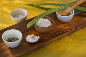 Aloe Vera dried herbs lotion and salt on wooden tray. Photo : Daniel Grill