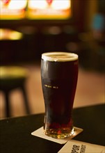 Glass of Irish ale in pub.