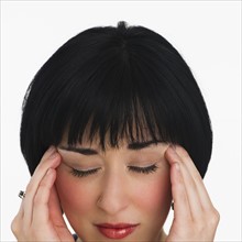 Woman with a headache. Photo. Daniel Grill