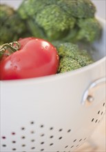 Colander of broccoli and tomatoes. Photo. Jamie Grill