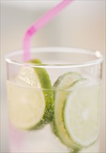 Lime slices in glass of water. Photo : Jamie Grill
