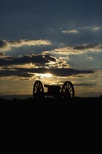 Sunset over civil war cannon. Photo. Daniel Grill