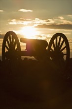 Sunset over civil war cannon. Photo. Daniel Grill