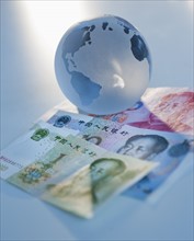 Globe on Chinese currency.