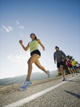 Runners on a road in Malibu.