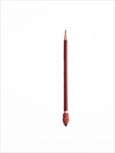 Red colored pencil. Photo. David Arky