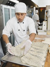 Chef making bread in bakery. Photo. Erik Isakson