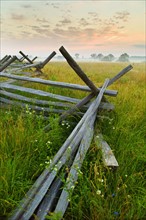 Rustic fence in field.