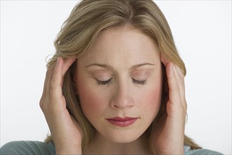Blond woman with a headache.
