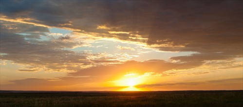 Sunset above prairie.