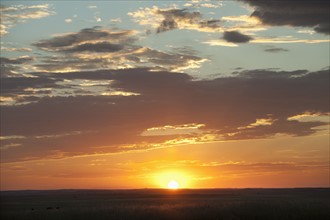 Sunset above prairie.
