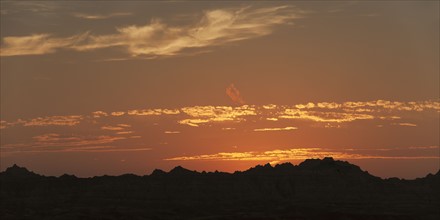 USA, South Dakota, Mountains in Badlands National Park at sunset.
