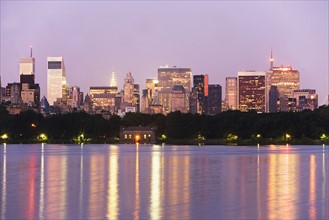 USA, New York State, New York City, Skyline with Bloomberg Building at dusk, view from Central Park