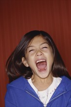 Young girl screaming. Photo : Fisher Litwin