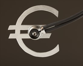 Stethoscope on "Euro" sign. Photo : Mike Kemp