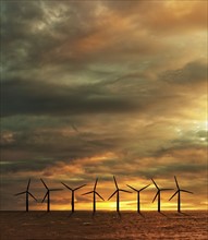Wind turbines in sea at sunset. Photo : Jon Boyes