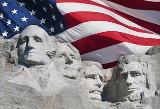 USA, South Dakota, Mount Rushmore National Memorial and American flag.