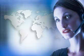 Customer service representative in front of world map.