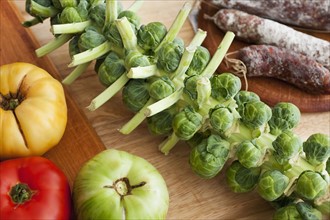 Tomatoes, sausage and brussel sprouts.