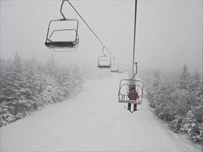 Skier on chair lift. Photo : Johannes Kroemer