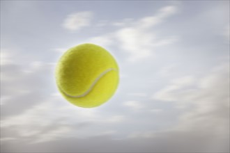 Tennis ball against sky. Photo : Mike Kemp
