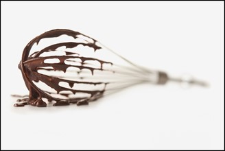 Wire whisk on white background. Photo : Mike Kemp