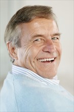 Portrait of smiling senior man. Photo : Momentimages