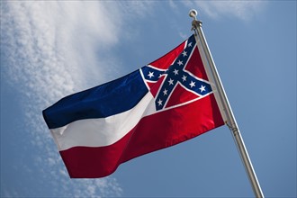 USA, Mississippi State flag against sky.