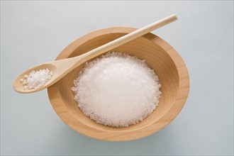Salt in wooden bowl with spoon. Photo : Chris Hackett