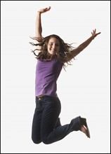 Woman jumping on white background. Photo : Mike Kemp