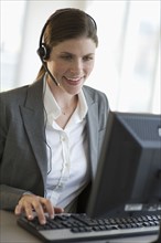 Woman working with headset.