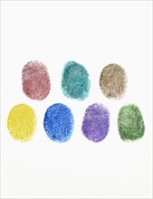 Close up of colorful fingerprints on white background.