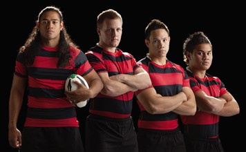 Studio portrait of male rugby team. Photo : Mike Kemp