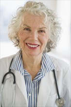 USA, New Jersey, Jersey City, Portrait of senior female doctor with stethoscope.
