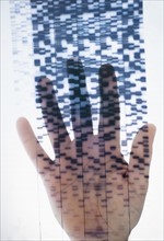 Human hand touching DNA chart.