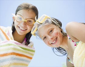 USA, New York, Two girls (10-11, 10-11) wearing swimming goggles. Photo : Jamie Grill Photography