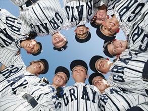 USA, California, Ladera Ranch, little league players (aged 10-11) in circle.