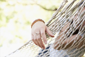 USA, Utah, close up of woman's hand on hammock. Photo : Tim Pannell