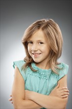 Studio portrait of girl (10-11) smiling. Photo : FBP