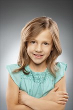 Studio portrait of girl (10-11) smiling. Photo : FBP