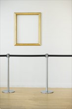 Blank picture frame in empty art gallery.