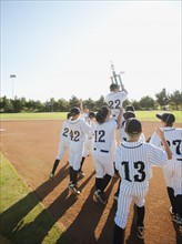 USA, California, Ladera Ranch, little league players (aged 10-11) celebrating.
