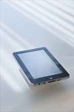 Digital tablet reflecting light.