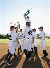 USA, California, Ladera Ranch, Boys (10-11) from Little league celebrating after winning.