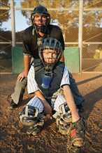 USA, California, Ladera Ranch, man and boy (10-11) playing baseball.