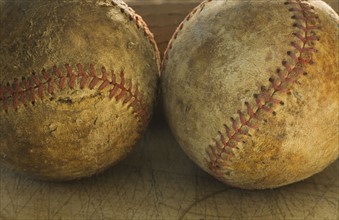 Two antique baseballs.