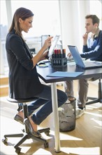 USA, New Jersey, Jersey City, Two young people in office.