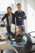 USA, New Jersey, Jersey City, Two young people in office.