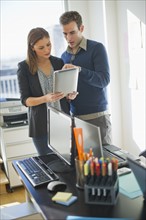 USA, New Jersey, Jersey City, Two young people in office.