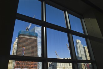 USA, New York, New York City, Construction site of World Trade Center through window.